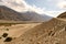 Sand Dunes along Wakhan Corridor. Panj river and Pamir mountains. Panj is upper part of Amu Darya river. Panoramic view.