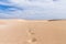 Sand dunes in Boavista desert with blue sky and clouds, Cape Verde - Cabo Verde