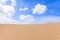 Sand dunes in Boavista desert with blue sky and clouds, Cape Verde - Cabo Verde