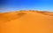 Sand dunes and cloudless blue sky