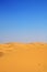 Sand dunes and cloudless blue sky