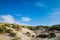 Sand dunes with grass and blue skies, Camber Sands