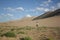 Between sand dunes and green vegetation, Gobi Desert, Mongolia.