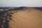 Sand dunes of the Maspalomas desert near the Atlantic Ocean.