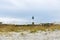 Sand Dunes on North Beach With Historic Tybee Island Light Station