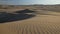 Sand dunes in Peruvian desert before sunset.