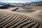 sand dunes in the shape of waves, with peaks and troughs