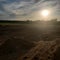 Sand dunes sun sky clouds dusk sun setting