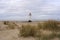 Sand dunes with Talacre lighthouse, North Wales, in the background.