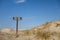 Sand dunes with wooded sign reading keep away from dunes