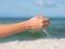 Sand falling from the woman\'s hand