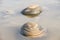 Sand forms abstract shape on the rocks as the tide goes out