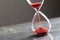 Sand glass, modern hourglass showing last second or last minute or time out. With copy space