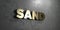 Sand - Gold sign mounted on glossy marble wall - 3D rendered royalty free stock illustration