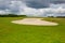 Sand golf bunker on a empty golf course