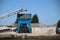 Sand hopper and silo with conveyor belt along riverside Hollandsche IJssel in Gouda for inland freight ships.