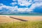 Sand lagoon near town of Nin in Dalmatia, Croatia. Adriatic coastline and blue sky with clouds.