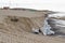 Sand pebble bag against erosion beach closeup