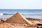 Sand pyramid on beach