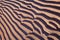 Sand ripples parallel line pattern on beach