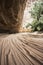 A sand road curve with wheel tracks in the Canyon de Chelly National Monument - Arizona