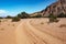 Sand road, dirt road and footprint Sandstone rock formations eroded by water and wind in the Talampaya Canyon National Park,