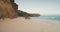 Sand rock coast waves washed in slow motion aerial view. Nobody tropic landscape of cliff shore