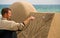 Sand sculptor work on beach