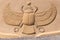 Sand sculpture depicting a scarab beetle