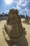 Sand sculpture lovers on the beach