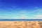 Sand on seaside under blue clear sky