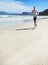 Sand, space or man at sea running for exercise, training or outdoor workout at beach for fitness. Sports person, mature
