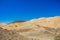 Sand stone desert rocky hills landscape wilderness scenic view environment vivid blue sky background space