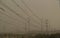 Sand Storm in Israel. Power Lines and Electricity Pylons