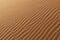 Sand texture - background of desert sand dunes. Beautiful structures of sandy dunes. sand with wave from wind in desert