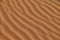 Sand texture - background of desert sand dunes. Beautiful structures of sandy dunes. sand with wave from wind in desert