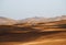 Sand texture with a car in Morocco Sahara Merzouga Desert landscape oriented