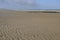 Sand waves on north sea beach, netherlands
