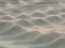 Sand waves pattern created by the wind on the beach