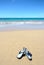 Sandals on Tropical Hawaii Beach. Surf, beach and Sunny Blue Sky day. Big Island, Hawaii