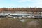 Sandbags flood protection holding back water from flooded river