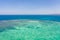 Sandbar on a coral reef. Atoll with a small sandy island