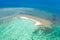 Sandbar on a coral reef. Atoll with a small sandy island