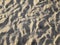Sandbeach sand with hidden child footprint