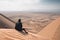 sandboarding on dune with view of the endless desert