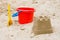 Sandcastle with bucket and shovel