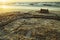 Sandcastle with moat on the Baltic beach at dusk.