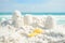 Sandcastle and shovel on Florida beach with white sand