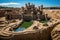 sandcastle surrounded by a detailed moat system