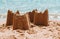 Sandcastles on the beach,vacation concept, toned.